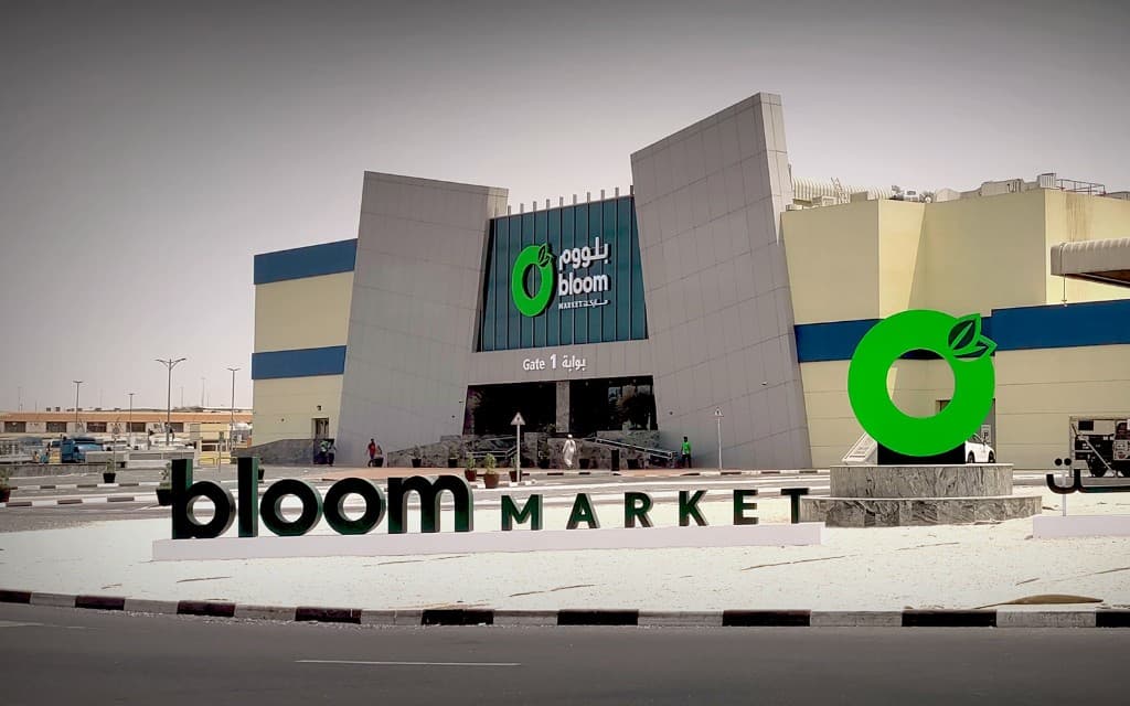 Design-build signage systems at Bloom Market